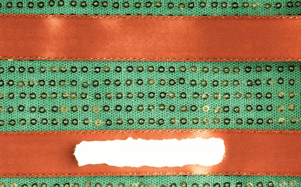 Grüne Pailletten Hintergrund Textur abstrakten Stoff Textil und rotes Band — Stockfoto