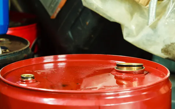 Red oil barrels in mechanic garage car service or shop — Stock Photo, Image