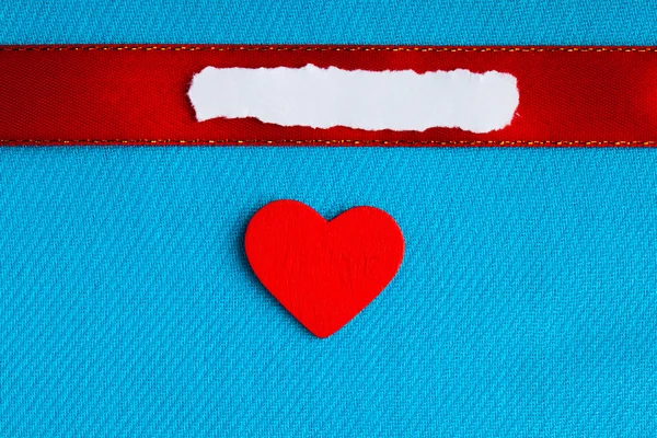 Valentines day background. paper blank heart on blue fabric material Stock Image