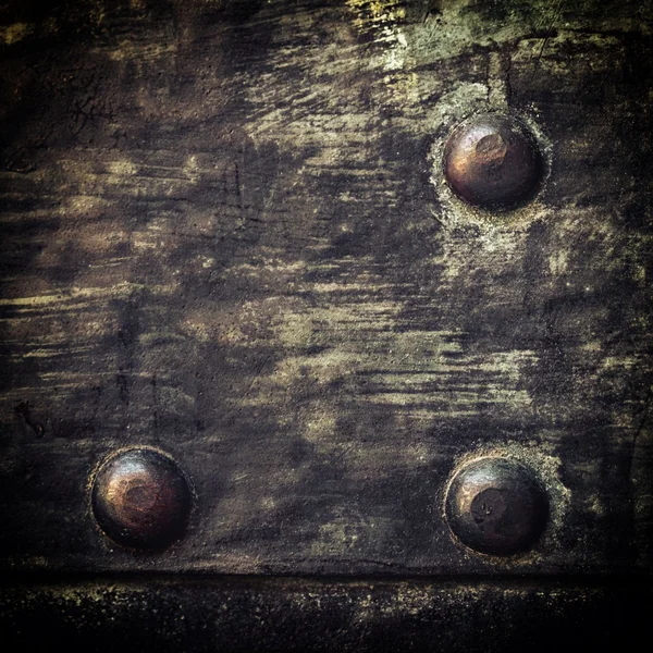 Grunge black metal plate with rivets screws background texture — Stock Photo, Image