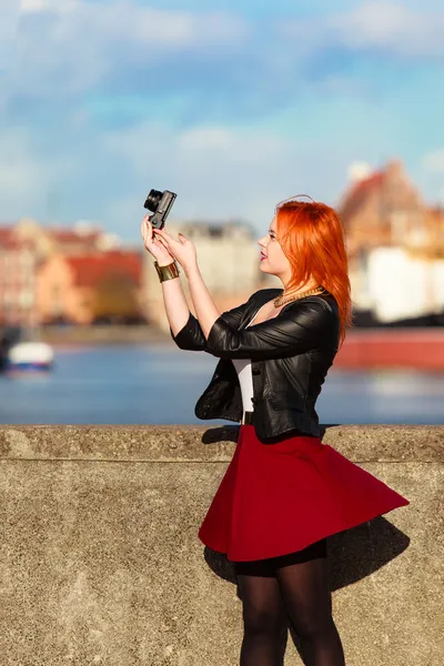 Traveler woman red hair girl with camera old town Gdansk — Stock Photo, Image