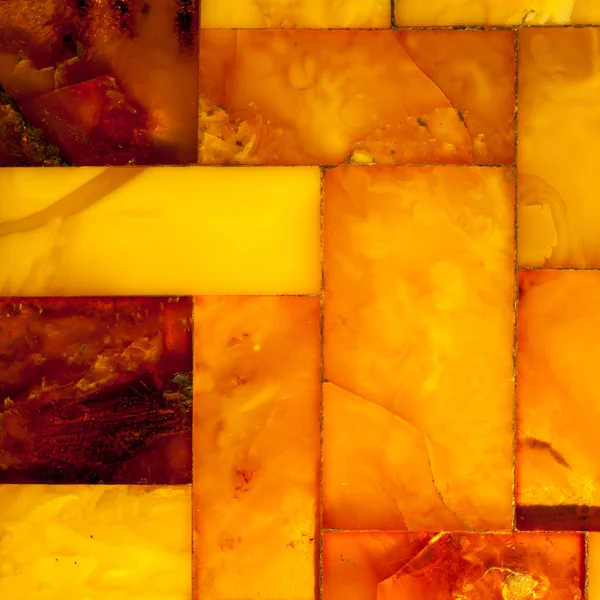 Closeup of golden amber mosaic as background or texture. Gem. — Stock Photo, Image