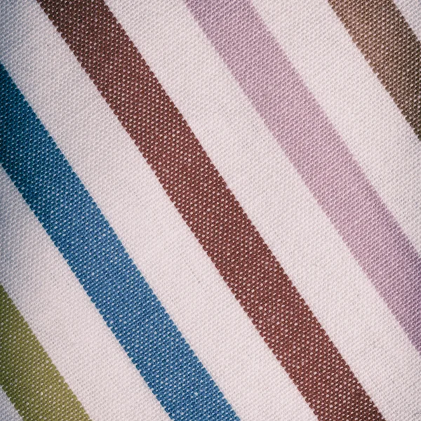 Крупный план разноцветного полосатого текстиля в качестве фона или текстуры — стоковое фото