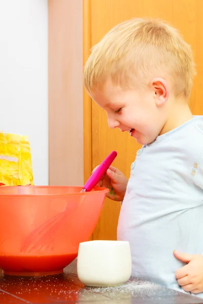 Boy kid baking cake. Child beating dough with wire whisk. Kitchen. — Stock Photo, Image