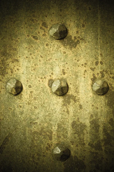 Plaque métallique grunge marron ou texture armure avec rivets — Photo