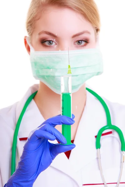 Woman in mask and lab coat. Doctor nurse with syringe. — Stock Photo, Image