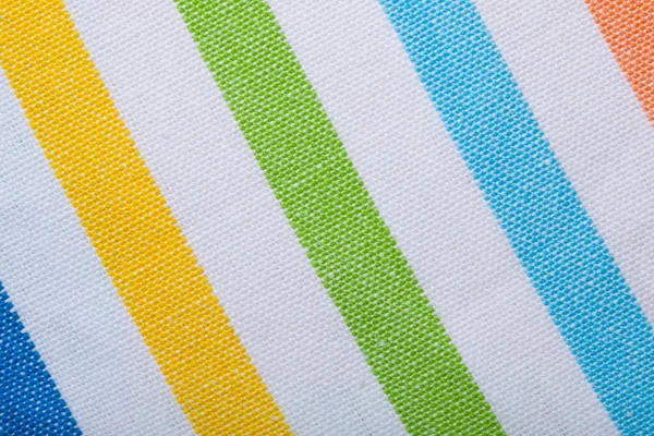 Primer plano del textil a rayas de colores como fondo o textura —  Fotos de Stock