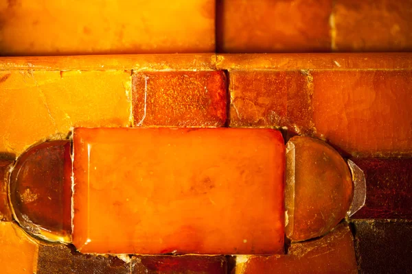 Close-up van gouden amber mozaïek als de achtergrond of het bitmappatroon. Gem. — Stockfoto