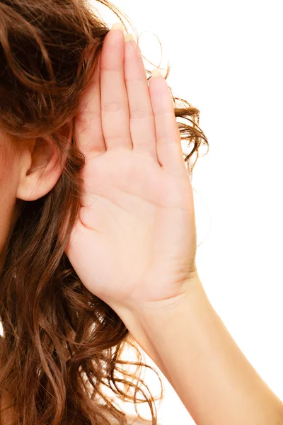 Part of head woman with hand to ear listening Stock Image
