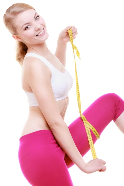 Fitness girl sporty woman measuring her thigh isolated — Stock Image Fitness girl sporty woman measuring her thigh isolated Stock Photo