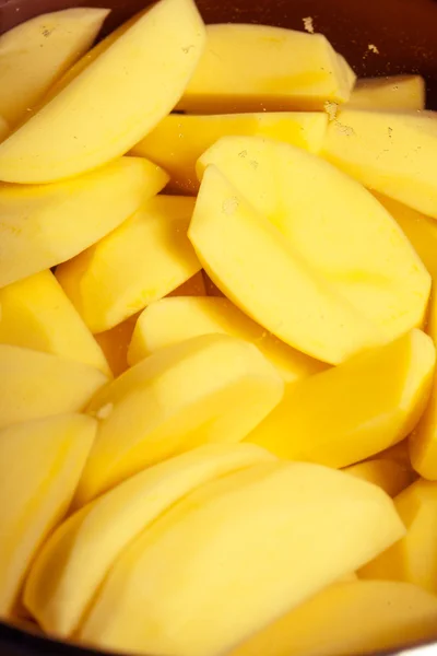 Closeup of raw peeled potatoes as food background. Cooking. — Stock Photo, Image