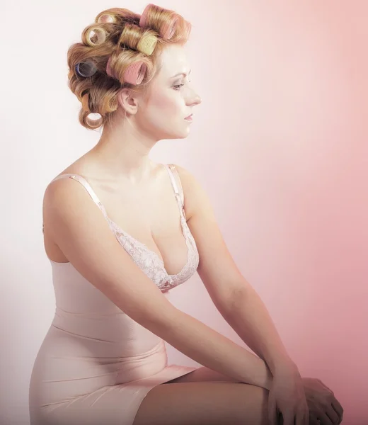 Sexy girl in underwear curlers preparing to party, pensive woman portrait — Stock Photo, Image