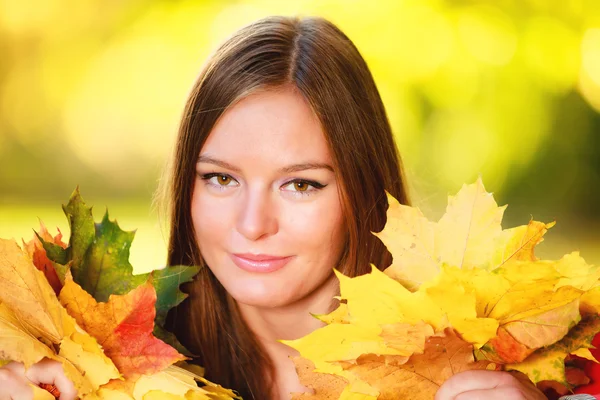 Fall season. Portrait girl woman holding autumnal leaves in park — Stock Photo, Image