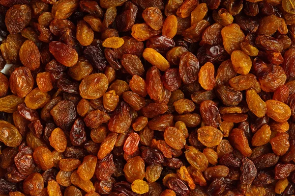 Alimento saludable para la dieta. Pasas de uva seca como textura de fondo —  Fotos de Stock