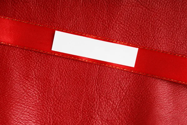 Piece scrap paper blank copy space on red leather background — Stock Photo, Image