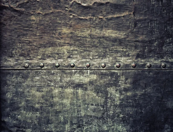 Grunge black metal plate with rivets screws background texture — Stock Photo, Image