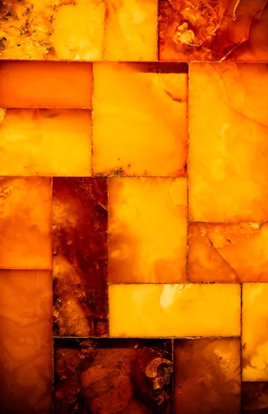 Closeup της χρυσή κεχριμπάρι μωσαϊκό ως φόντο ή την υφή. στολίδι. — Φωτογραφία Αρχείου