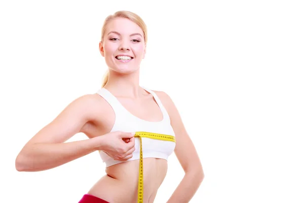 Fitness woman fit girl with measure tape measuring her bust — Stock Photo, Image