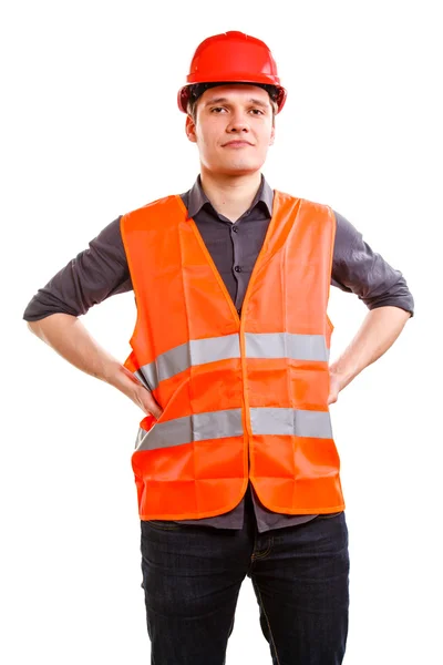 Homem trabalhador em colete de segurança e chapéu duro. Segurança no trabalho . — Fotografia de Stock