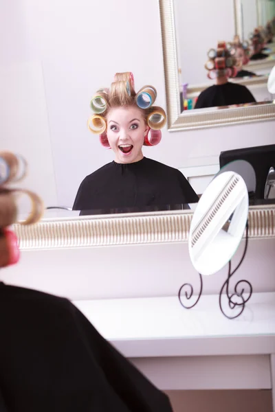 Cheerful happy blond girl hair curlers rollers hairdresser beauty salon — Stock Photo, Image
