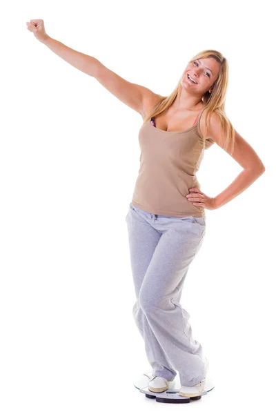 Woman plus size on scale celebrating weightloss isolated — Stock Photo, Image