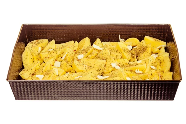 Raw peeled potatoes with spices and butter in tray isolated. Food. — Stock Photo, Image