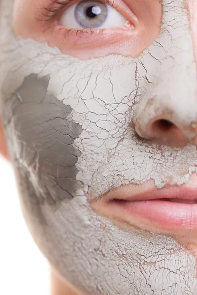 Skin care. Woman applying clay mask on face. Spa. — Stock Photo, Image
