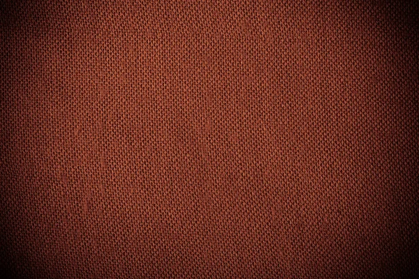 Closeup των κλωστοϋφαντουργικών υλών κόκκινο καφέ ύφασμα ως υφή φόντου — Φωτογραφία Αρχείου