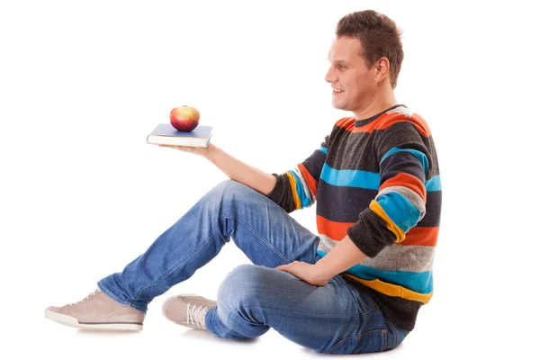 Man holding book and red apple. Healthy mind and body Stock Photo