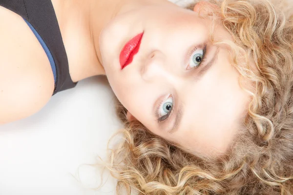 Portrait beautiful blond girl make up lying on floor studio shot — Stock Photo, Image