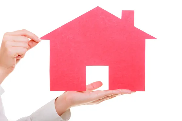 Business woman real estate agent holding red paper house — Stock Photo, Image