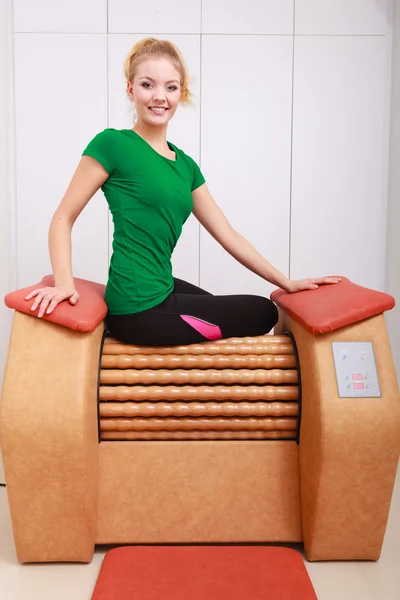 Girl in sportwear on relax massage equipment healthy spa salon — Stock Photo, Image