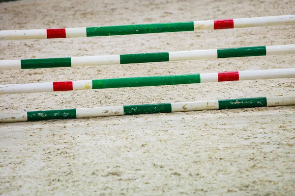 Green red white obstacle for jumping horses. Riding competition. — Stock Photo, Image