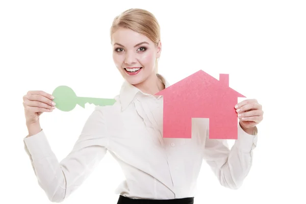 Business woman real estate agent holding red paper house key — Stock Photo, Image