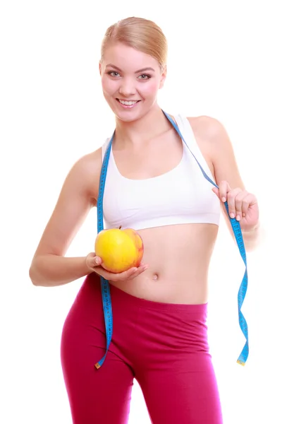 Diet. Fitness woman fit girl with measure tape and apple fruit — Stock Photo, Image