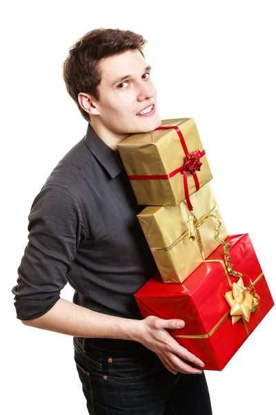 Holiday. Young man giving presents gifts boxes — Stock Photo, Image