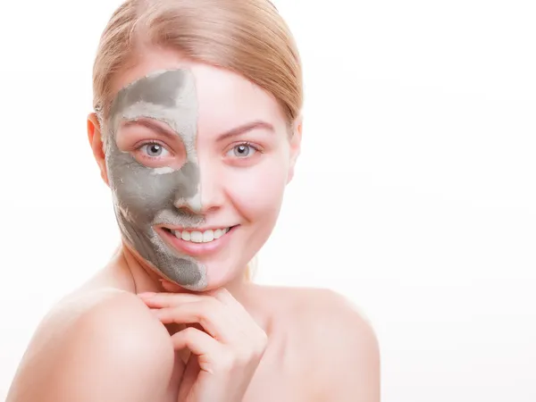 Skin care. Woman applying clay mask on face. Spa. — Stock Photo, Image