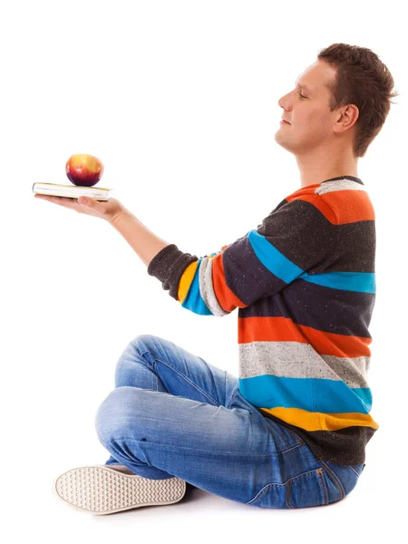 Homme tenant livre et pomme rouge. Esprit et corps sains — Photo