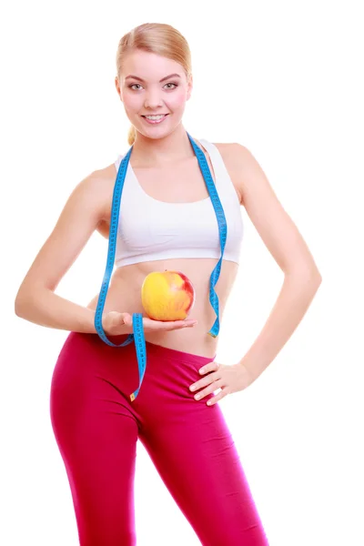 Diet. Fitness kvinna passar flicka med mått band och apple frukt — Stockfoto