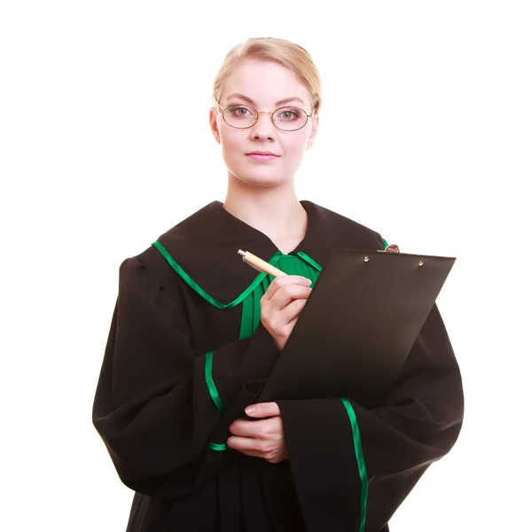 Woman lawyer attorney in classic polish gown writing on clipboard — Stock Photo, Image