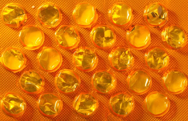 Orange package of pills tablets drug medicine as background — Stock Photo, Image