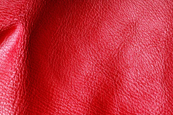 Texture of folds vivid red skin leather background — Stock Photo, Image