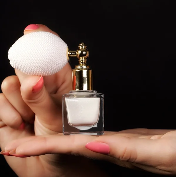 Female hand with perfume bottle — Stock Photo, Image