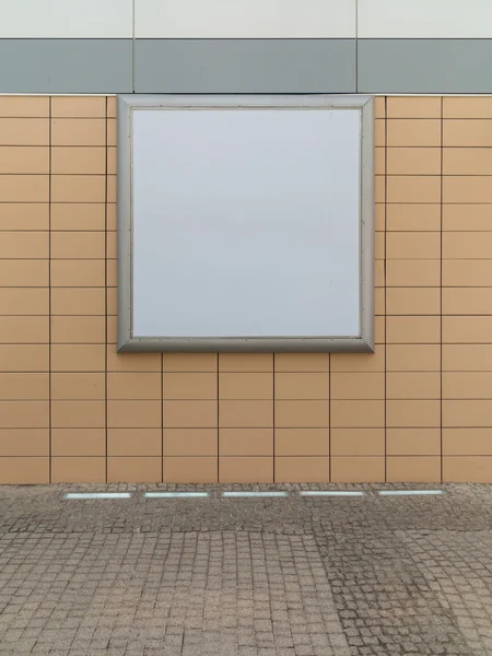 Empty blank square white advertising billboard on orange tiled wall — Stock Photo, Image