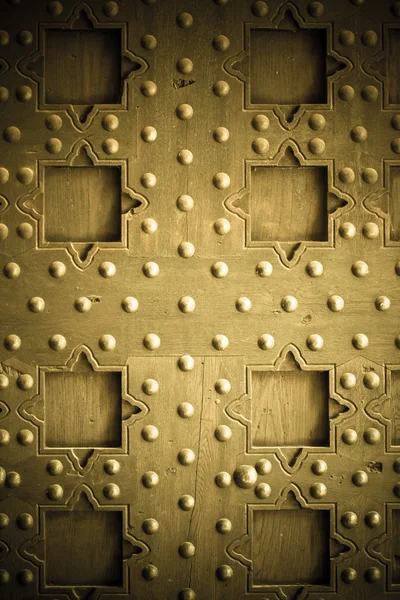 Old wooden background with metal rivets vintage door detail — Stock Photo, Image