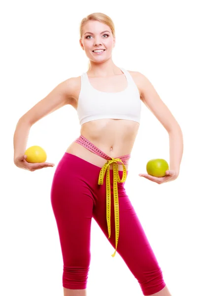 Diet. Fit girl with measure tapes citrus fruits — Stock Photo, Image