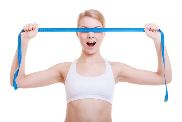 Fitness sporty girl covering her eyes with measuring tape isolated — Stock Photo, Image