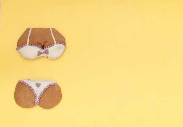 Funny bikini underwear shape gingerbread cake cookie on yellow — Stock Photo, Image