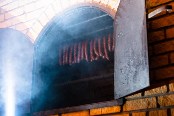 Smoked sausuages in smokehouse. — Stock Photo, Image
