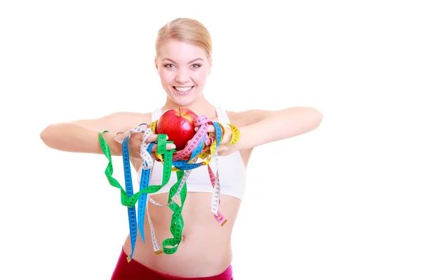 Fitness  girl holding colorful measure tapes fruit — Stock Photo, Image